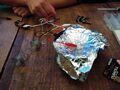 Victorian Synthesizer speaker hack with foil, clip, spring, and battery